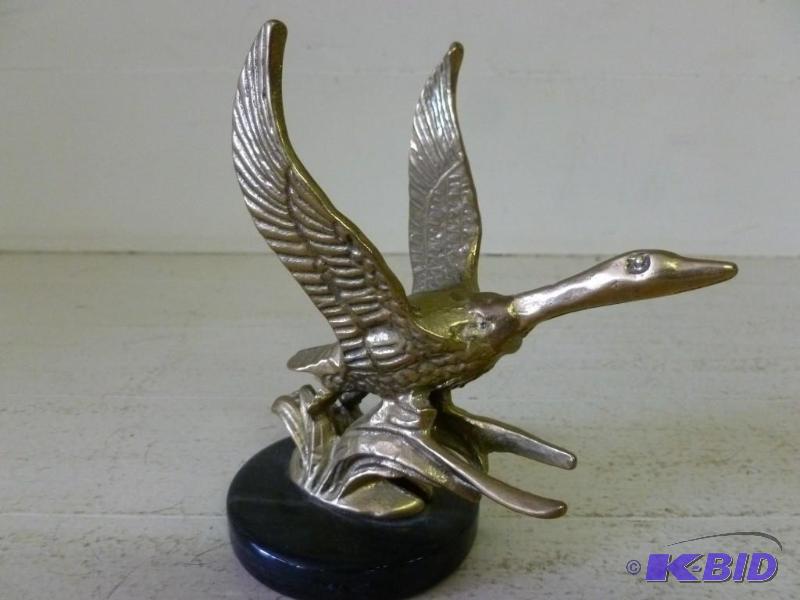 lot 94 image: Vintage cast brass goose on marble stand that...