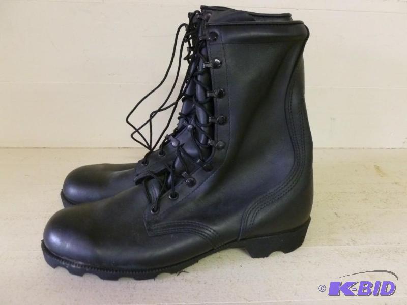 lot 99 image: A pair of military high top leather boots siz...
