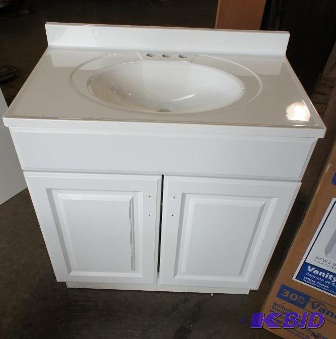 lot 8 image: Glacier bay vanity combo sink. Dimensions 18...