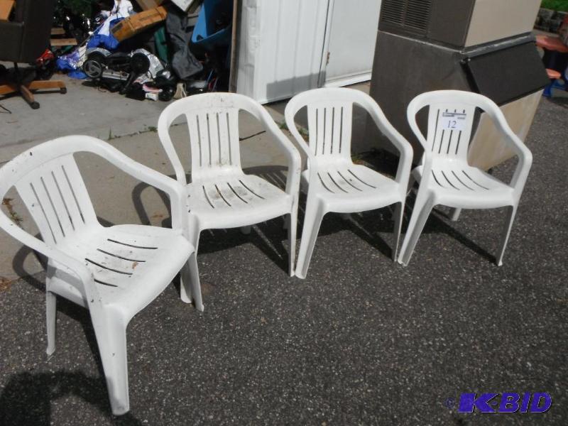 lot 12 image: A Collection of Four White, Plastic Patio Cha...