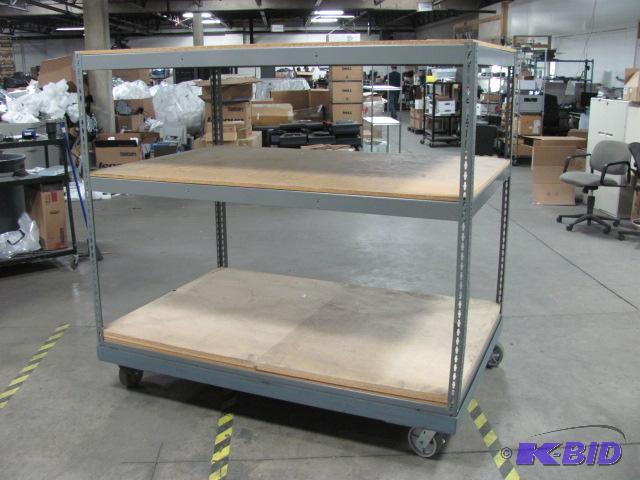lot 100 image: Large rack on wheels. This rack is made of st...