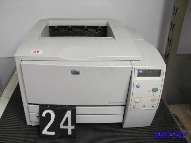 lot 24 image: HP laserjet 2300n printer. This unit has prin...