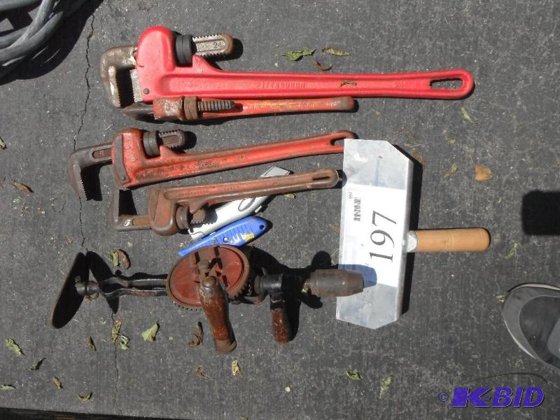 lot 197 image: 4 Pipe Wrenches, 2 Knives, 1 Hand Drill, 1 Ta...