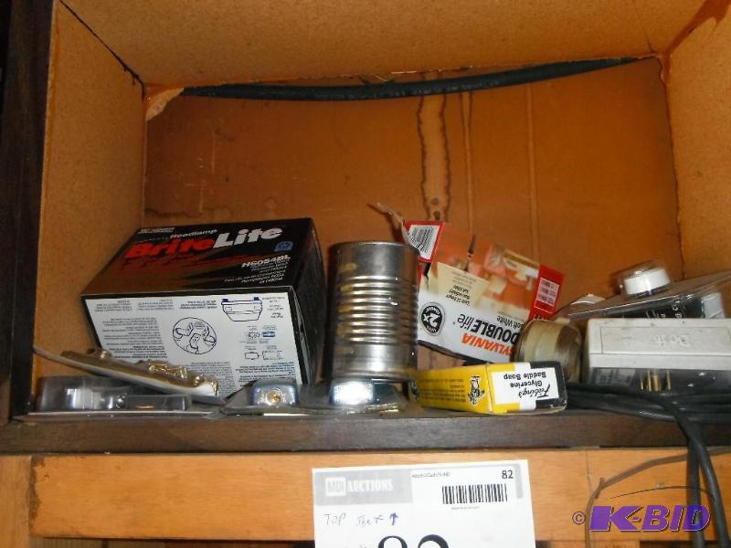 lot 82 image: Shelf with various items including Brite Ligh...