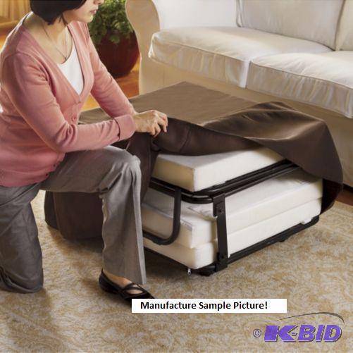 Folding Ottoman Has Brown Slip Cover As an ot...