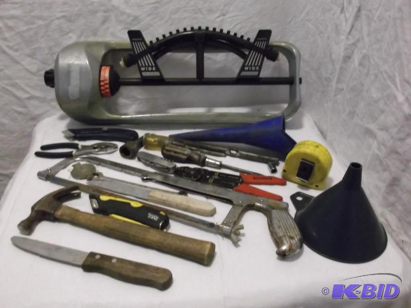 Lot with lawn sprinkler,funnels and miscellan...