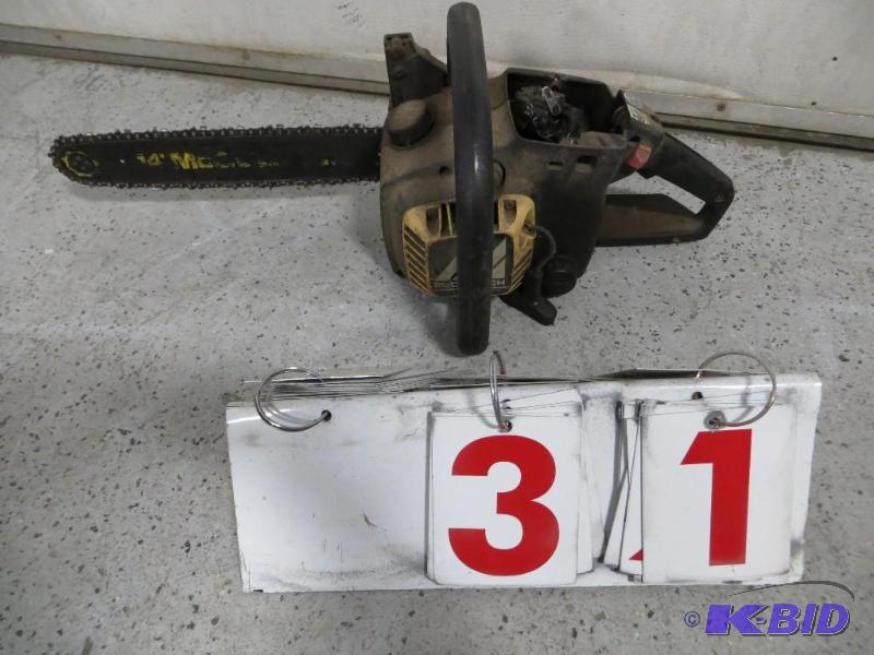 lot 31 image: 14" McCulloch Chain Saw. Has Compression...