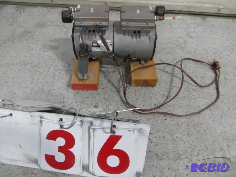 lot 36 image: Thomas Vacuum Pump....