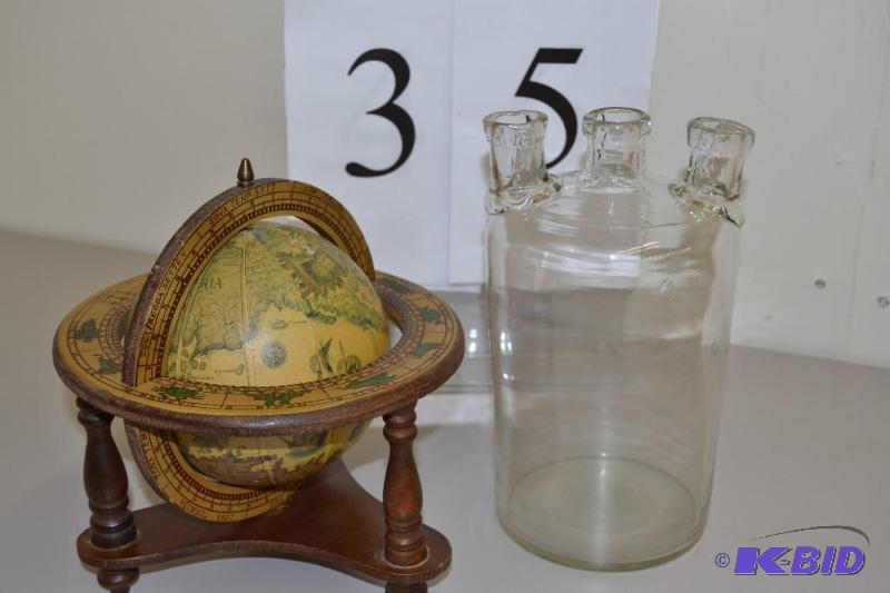 lot 35 image: Globe and glass container