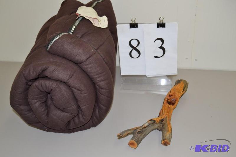 lot 83 image: Wood carving, sleeping bag