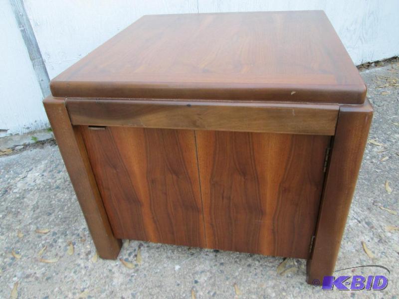 lot 202 image: Nice solid wood end table with door cubby und...