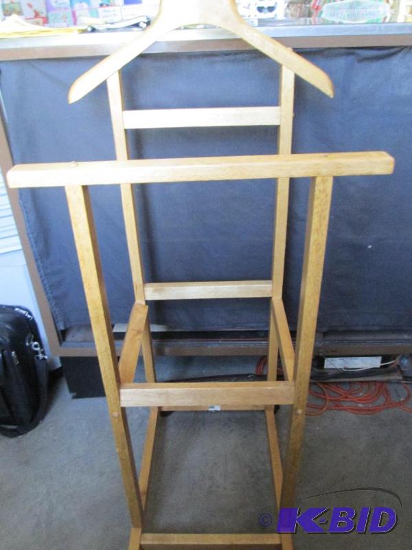 lot 58 image: Solid wood garment  valet rack on wheels...