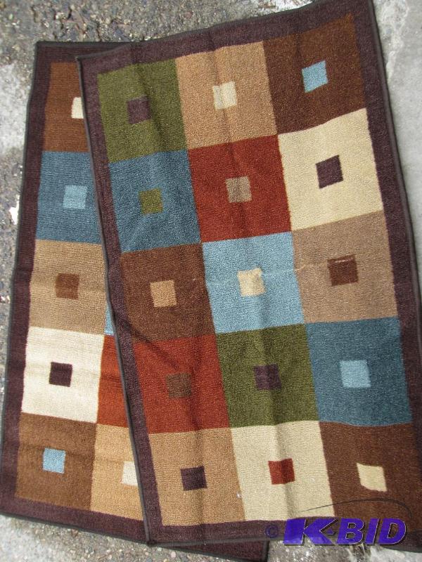lot 6 image: Pair of matching entrance or other rugs...