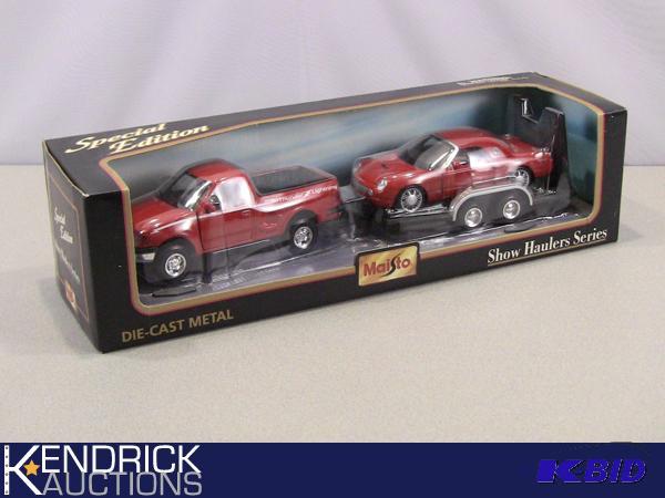 lot 57 image: New in Package Maisto Show Haulers Series Die Cast 1997 Ford F-150 Pulling a Ford Thunderbird