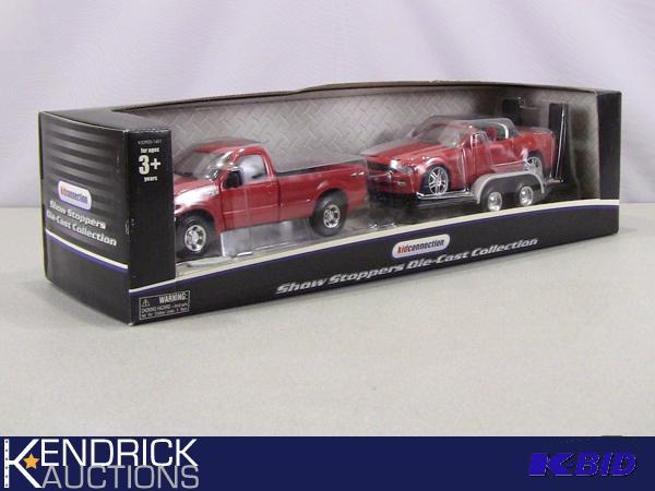 lot 58 image: New in Package Maisto Show Stoppers Die Cast Collection 1999 Ford F-350 Pulling a Ford Mustang