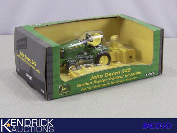 lot 59 image: New In Package Ertl Die Cast John Deere 345 Garden Tractor