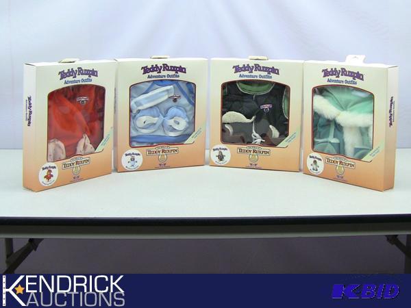 lot 77 image: 4 New in the Box Vintage Teddy Ruxpin Adventure Outfits