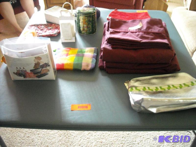 lot 172 image: Mary Kay products, makeup bags and queen sheet set with pillow cases