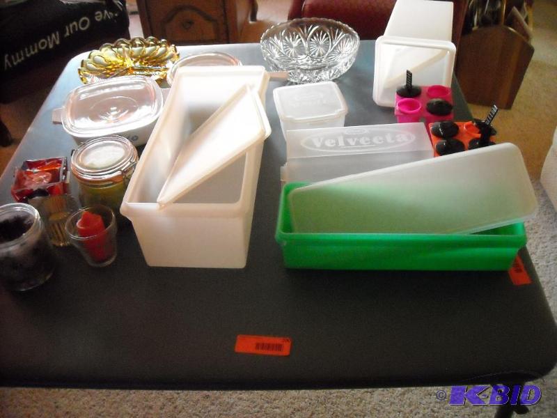 lot 200 image: Lots of Tupperware items and glass dishes, and candles