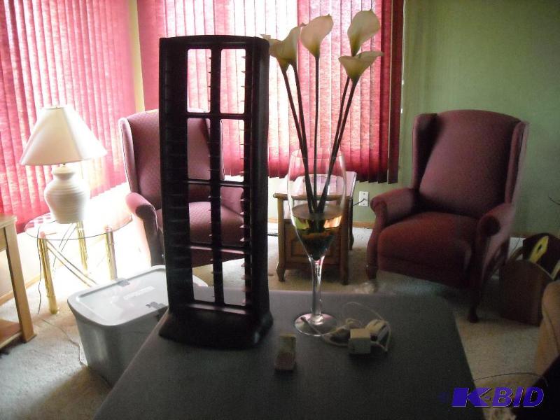 lot 220 image: DVD rack, large case with fake cala lily flow...