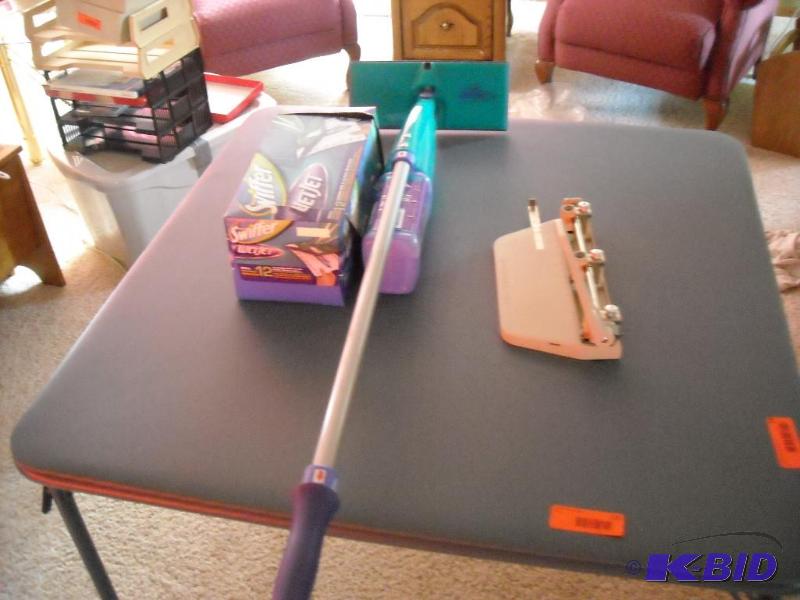 lot 237 image: Swiffer wet jet waccessories and 3 hole paper puncher
