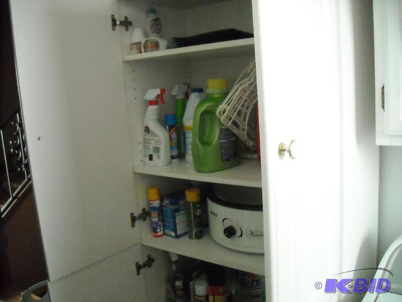 lot 238 image: 4 door cabinet with 4 total shelves