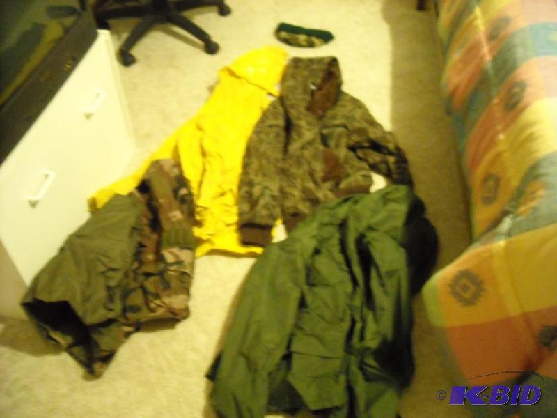 lot 72 image: yellow rain coat, camouflage hooded sweatshir...
