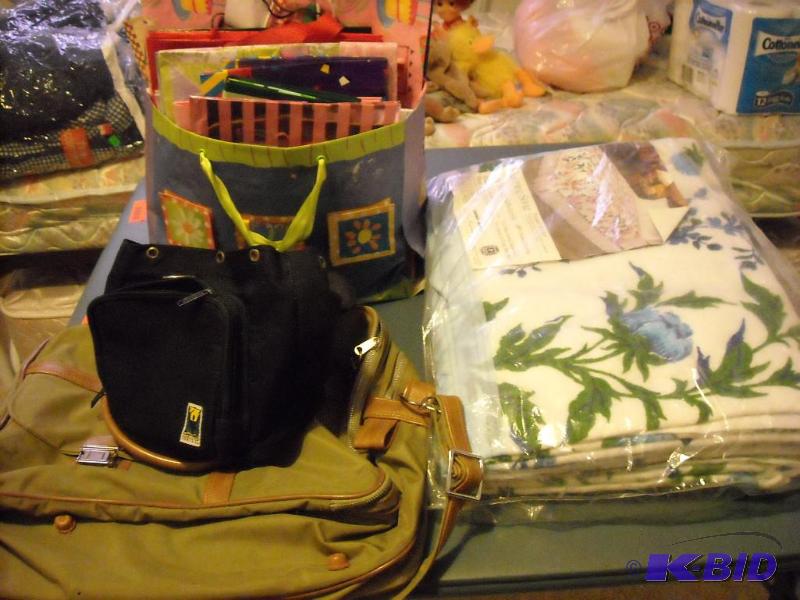 lot 93 image: duffle bag, gift bags and blanket