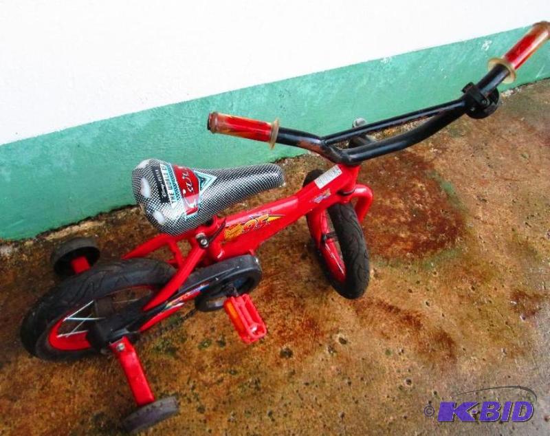 lot 99 image: The world of Cars bike with training wheels...
