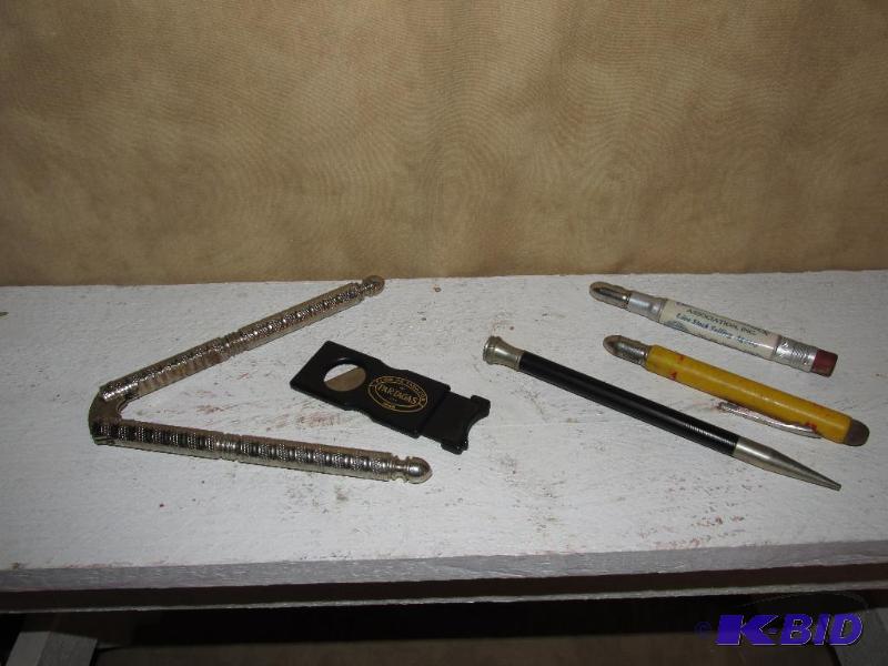 lot 131 image: Nut Cracker, Cigar Cutter and some pencils.