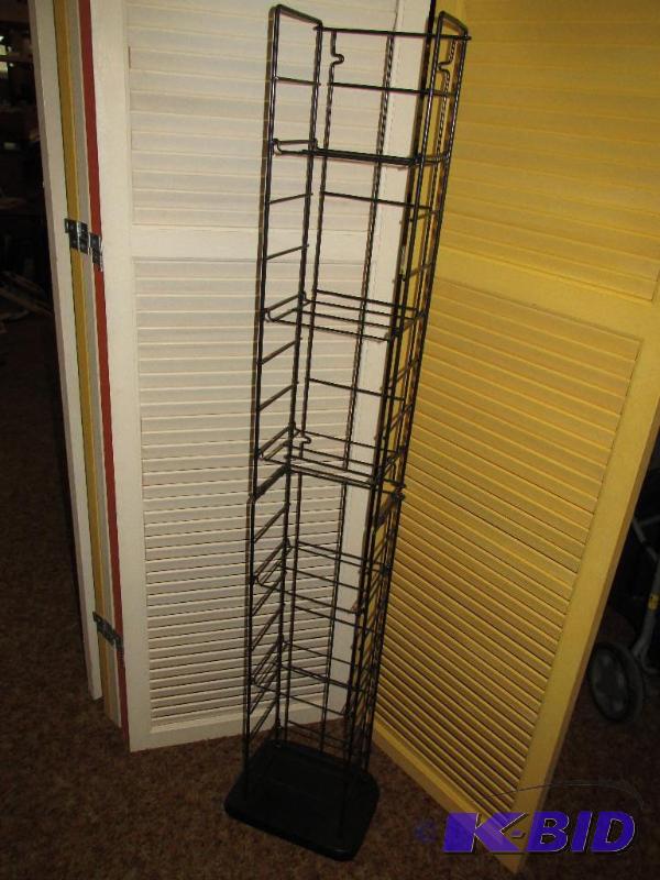 lot 249 image: Tall Metal Rack for DVDs or VHS