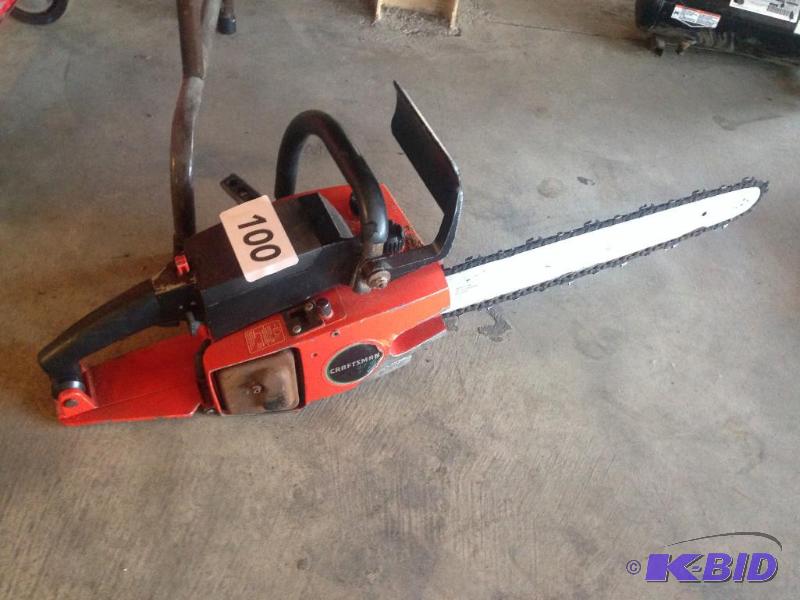 lot 100 image: Craftsman chainsaw. Motor is hard to turn ove...