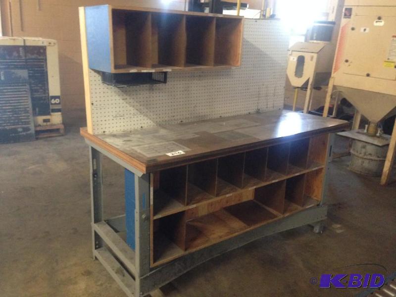 lot 216 image: Work bench with pegboard back and cubbies und...