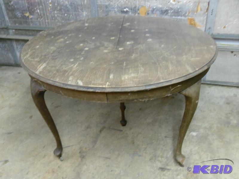lot 107 image: Old wood dining table. 54" diameter and ...