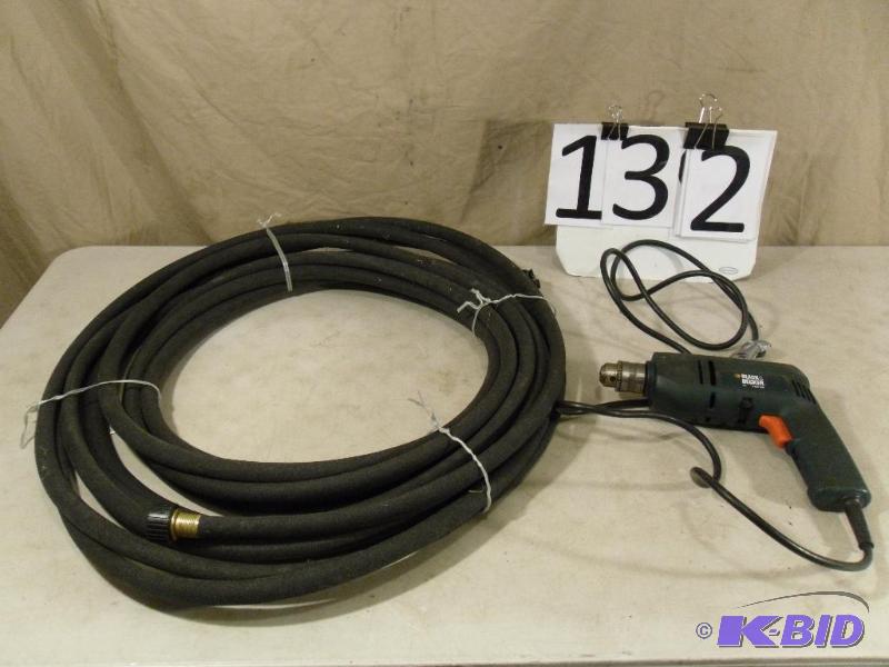 lot 132 image: Black Soaker Garden Hose and Black and Decker...