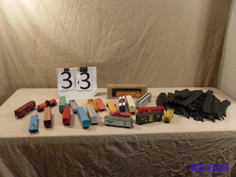 lot 33 image: Lot of HO Scale Cars, Caboose, and Track. Som...
