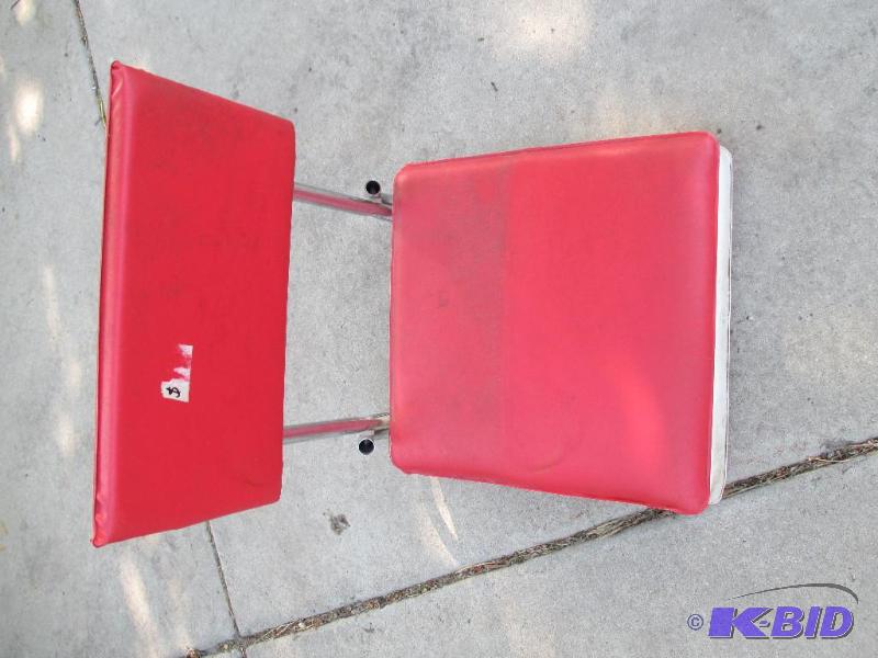 lot 102 image: red benchboat chair...
