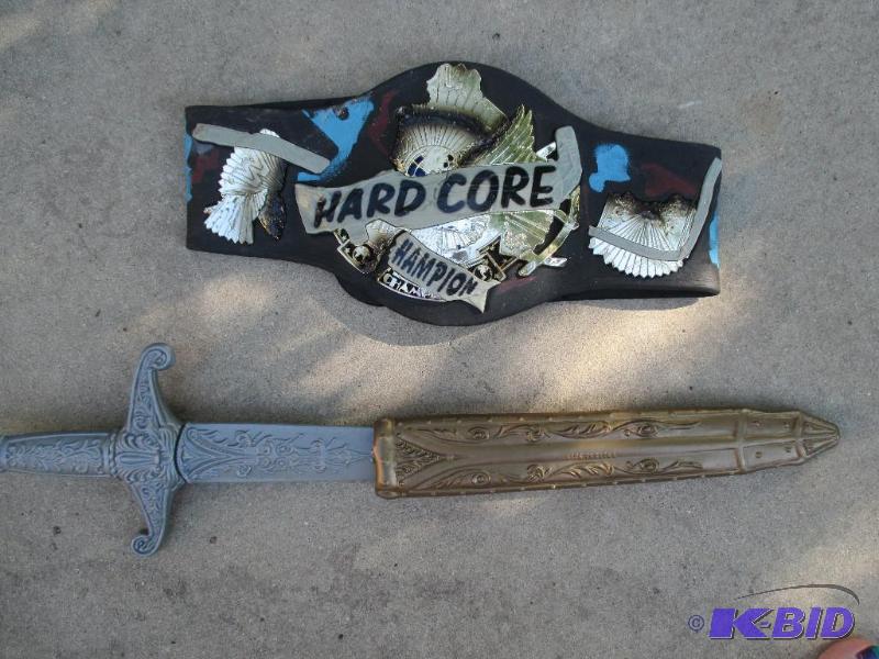 lot 104 image: hard core hampion toy belt and sword...