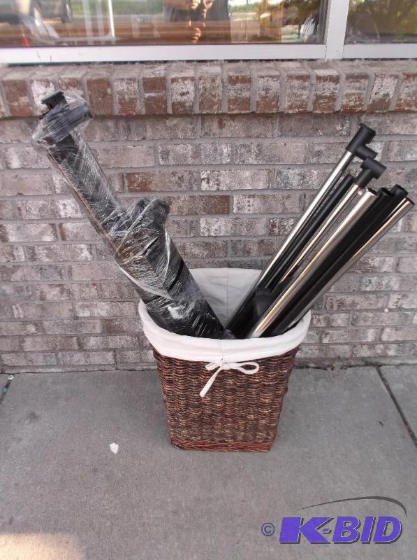 lot 74 image: Two Clothes Racks In A Basket, They Look Comp...