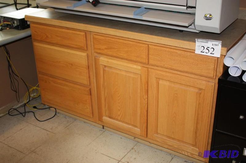 (3) sections of Oak finish cabinets, (1) draw...