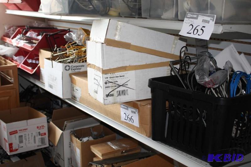 Collection of various cables, pegboard, hange...