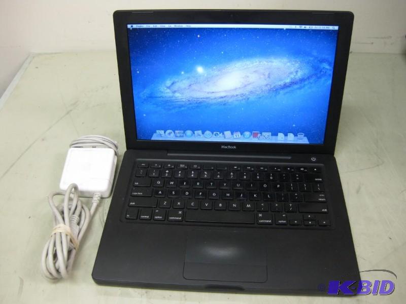 lot 1 image: Apple MacBook 4,1 Black Personal Laptop Runs...