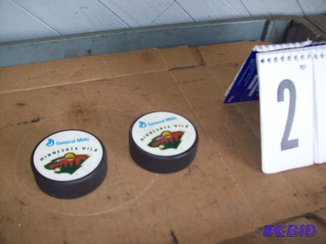 A pair of Minnesota Wild hockey pucks...