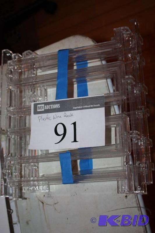 lot 91 image: Clear Plastic Wine Rack, Disassembled in Phot...