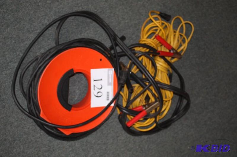 lot 129 image: Lot of extension cords and jumper cables...