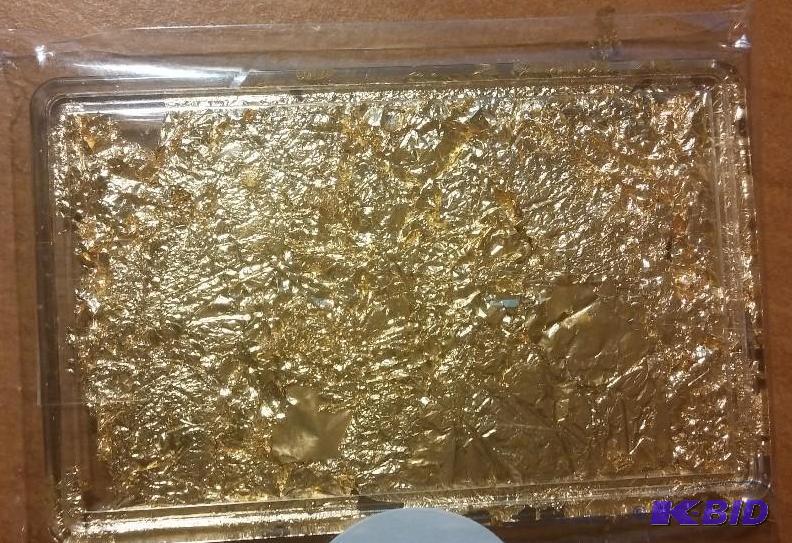BAR OF GOLD FLAKES PACKED INTO A PLASTIC HOLD...