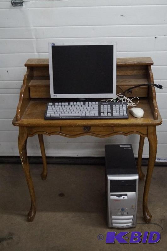 wood desk and computer