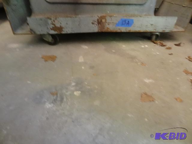 lot 13 image: Metal dollie on 4 heavy duty casters. 24 x 62...