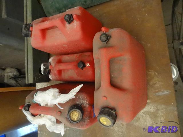 lot 149 image: 4 gas cans. One has gas in it...