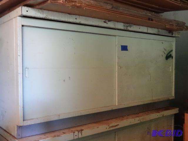 lot 15 image: Metal cabinet with sliding doors. 2 shelves. ...